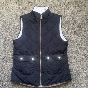 Small gently used reversible vest with pockets.